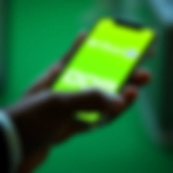Mobile phone displaying M-Pesa payment application with digital currency icons